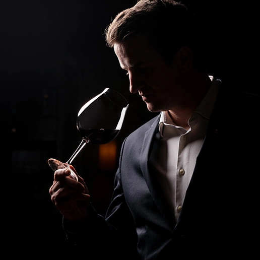 A man smelling a glass of wine at the restaurant Dans le Noir ?