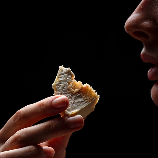 Woman enjoying a bite at Dans le Noir ?