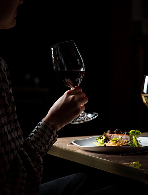 Tasting a food and wine pairing during a special Mother’s Day dinner at Dans le Noir ? restaurant